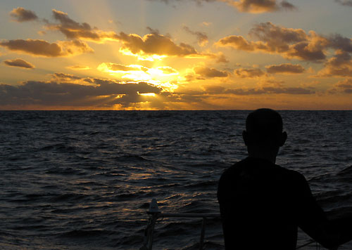 Injured Laurent Pages looks at the sunset onboard Telefonica Blue, on leg 2 of the Volvo Ocean Race, from Cape Town, South Africa to Cochin, India. Photo copyright Gabriele Olivo / Telefonica Blue / Volvo Ocean Race.