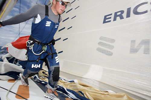 Martin Krite changing sails in light shitfy breeze just before the Doldrums, on leg 2 of the Volvo Ocean Race, from Cape Town, South Africa to Cochin, India. Photo copyright Gustav Morin / Ericsson 3 / Volvo Ocean Race.