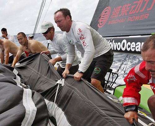 Green Dragon stacking sail bags as they tack, on leg 3 of the Volvo Ocean Race from India to Singapore. Photo copyright Guo Chuan / Green Dragon Racing / Volvo Ocean Race.
