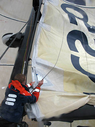 Bowman Martin Krite reefs the mainsail on Ericsson 3 en route to Rio De Janeiro on Leg 5 of the Volvo Ocean Race. Photo copyright Gustav Morin / Ericsson 3 / Volvo Ocean Race.