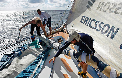 Anders Dahlsjo, Martin Krite and Aksel Magdahl taking down the masthead code zero, on leg 5 of the Volvo Ocean Race, from Qingdao to Rio de Janeiro. Photo copyright Gustav Morin / Ericsson 3 / Volvo Ocean Race.