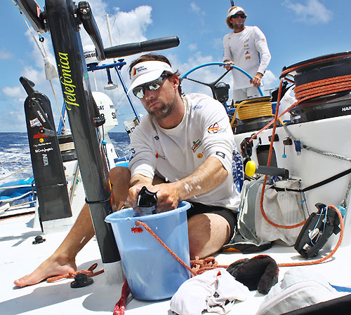 Iker Martinez on washing duty onboard Telefonica Blue, on leg 5 of the Volvo Ocean Race, from Qingdao to Rio de Janeiro. Photo copyright Gabriele Olivo / Telefonica Blue / Volvo Ocean Race.