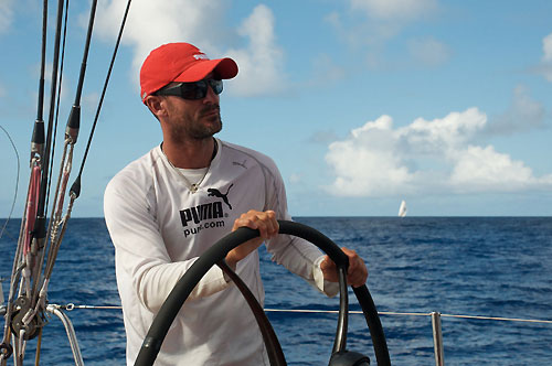 Sidney Gavignet helming onboard PUMA Ocean Racing while Ericsson 4 takes our stern, during leg 5 of the Volvo Ocean Race, from Qingdao to Rio de Janeiro. Photo copyright Rick Deppe / PUMA Ocean Racing / Volvo Ocean Race.