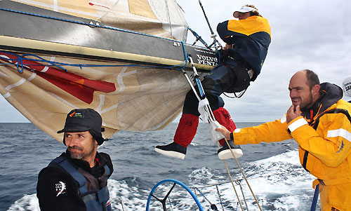 Telefonica Blue set about repairing their damaged mainsail, on leg 5 of the Volvo Ocean Race, from Qingdao to Rio de Janeiro.