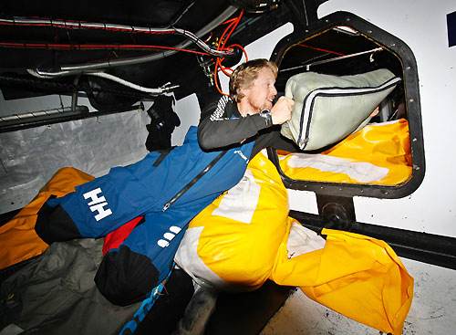 Navigator Aksel Magdahl stacking, onboard Ericsson 3, on leg 5 of the Volvo Ocean Race, from Qingdao to Rio de Janeiro. Photo copyright Gustav Morin / Ericsson 3 / Volvo Ocean Race.