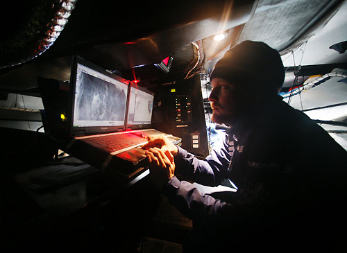Navigator Aksel Magdahl checks the weather onboard Ericsson 3, on leg 5 of the Volvo Ocean Race, from Qingdao to Rio de Janeiro. Photo copyright Gustav Morin / Ericsson 3 / Volvo Ocean Race.