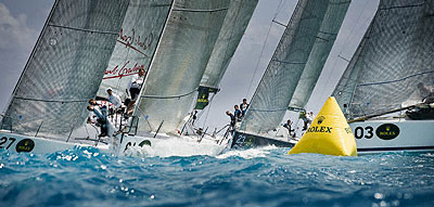 Ernesto Bertarelli's Alinghi (SUI) rounding the windward mark ahead of John Demourkas' Groovederchi 127 (USA), Rodrick Jabin's Ramrod (USA), and Danilo Salsi's DSK Comifin (ITA). Photo copyright ROLEX Kurt Arrigo.