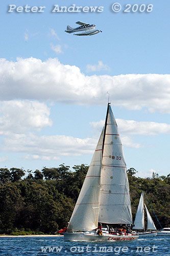 Bruce Taylor's IRC 40 Chutzpah from Victoria under a Rose Bay sea plane ahead of the start of the 2008 Sydney to Gold Coast Yacht Race.