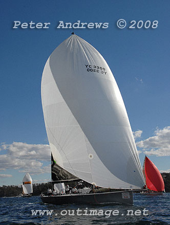 Geoff Boettcher's Reichel Pugh 47 Secret Mens' Business 3 under spinnaker and running down to the heads after the start of the Sydney to Gold Coast Yacht Race.