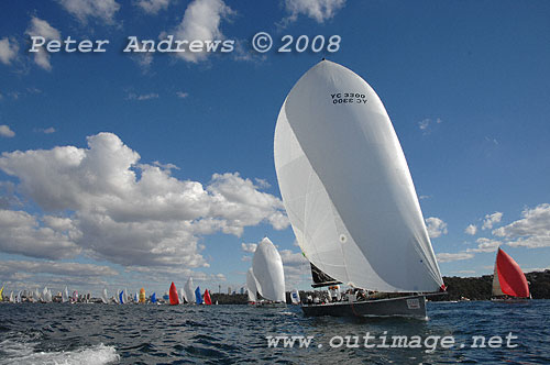 Geoff Boettcher's Reichel Pugh 47 Secret Mens' Business 3 under spinnaker and running down to the heads after the start of the Sydney to Gold Coast Yacht Race.