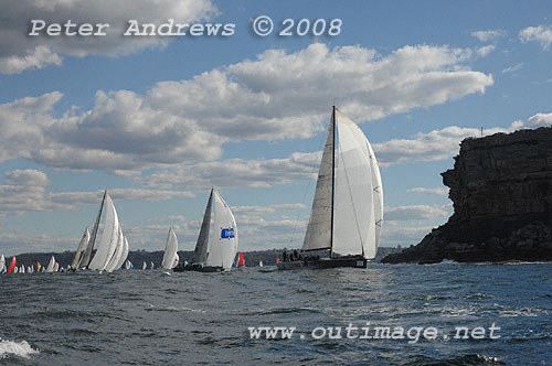 Michael Hiatt's Cookson 50 Living Doll from Victoria ahead of Matthew Short's IRC52 Shortwave and Stephen David's Reichel Pugh 60 Wild Joe with the rest of the fleet trailing under North Head.