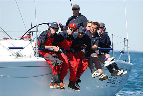 Crew along the rail of Kevin Miller and John Hasslers Farr 40 Bribie Star, (skippered by Peter Sherwood) after the start of the Brisbane to Keppel Tropical Yacht Race. Photo Copyright, Suellen Hurling.