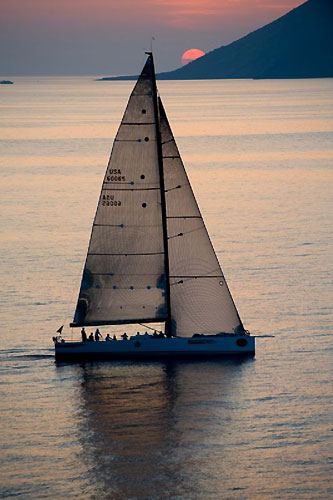 Roger Sturgeon's Rosebud / Team DYT making slow progress towards Stromboli at dusk, during the Rolex Middle Sea Race 2008. Photo copyright ROLEX and Kurt Arrigo.