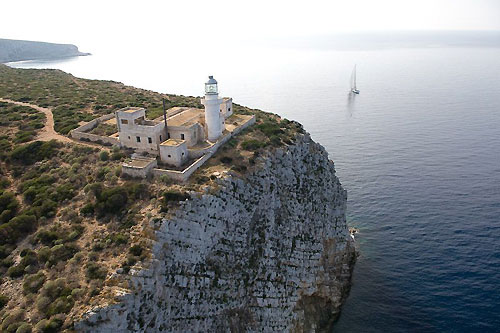 Jeff Hanlon's Farr 100 Rapture passes Capo Rosso's lighthouse during the Rolex Middle Sea Race 2008. Photo copyright ROLEX and Kurt Arrigo.