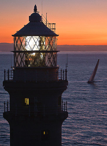 Karl Kwok's Blue Water 80 Beau Geste, passing Fastnet Rock Lighthouse, during the Rolex Fastnet Race 2009. Photo copyright Rolex - Carlo Borlenghi.