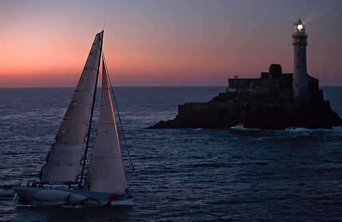 Karl Kwok's Blue Water 80 Beau Geste, passing the Fastnet Rock during the Rolex Fastnet Race 2009. Photo copyright Rolex - Carlo Borlenghi.