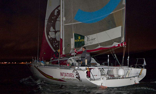 Tanguy de Lamotte's Class 40, Initiatives Saveurs - Novedia Group, crossing the Plymouth finish line during the Rolex Fastnet Race 2009. Photo copyright Rolex - Carlo Borlenghi.