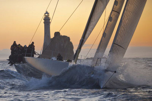 Niklas Zennstrom's RAN 2 rounding Fastnet Rock at sunrise, during the Rolex Fastnet Race 2009. Photo copyright Rolex - Kurt Arrigo.