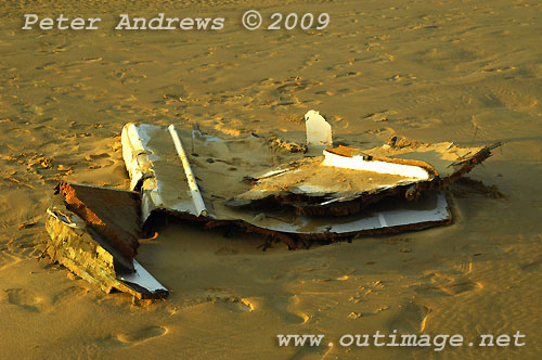 Carbon fibre and other remains from Shockwave 5, stacked by local Surf Lifesavers for collection after washing up on Corrimal Beach, NSW Australia. Photo copyright Peter Andrews.