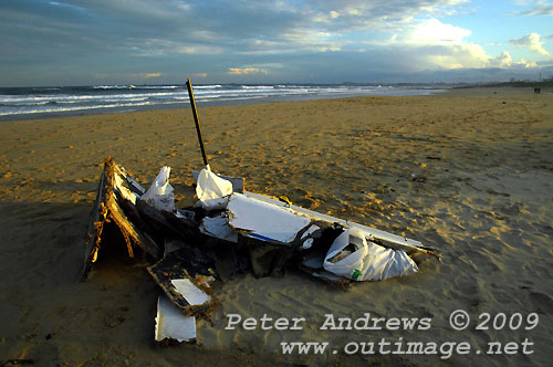 Carbon fibre from Shockwave 5, washed up on Corrimal Beach, NSW Australia with Towradgi Point in the background. Photo copyright Peter Andrews.