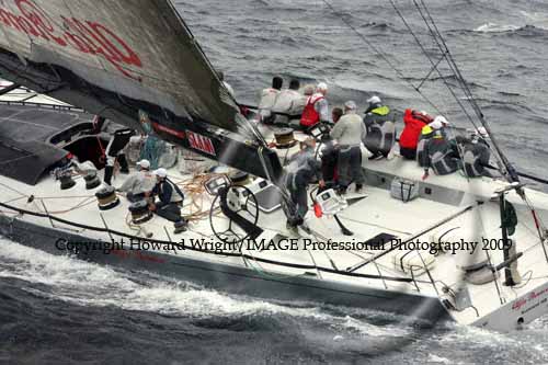 Neville Crichton's 100 foot supermaxi Alfa Romeo, outside Sydney Heads after the start of the Rolex Sydney Hobart Yacht Race 2009. Photo copyright Howard Wright, IMAGE Professional Photography.