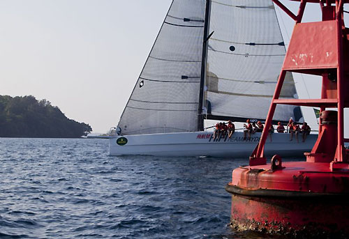 Neil Pryde's Welbourne 52 Custom Hi Fi, crossing the Subic Bay finish line to take Line Honours in the Rolex China Sea Race 2010. Photo copyright Daniel Forster, Rolex.