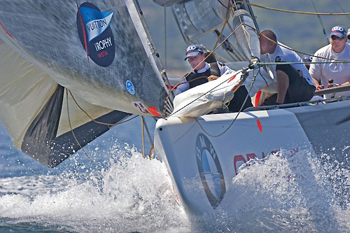 Louis Vuitton Trophy, La Maddalena, Sardegna. First day of racing for the teams but only two races finished before the wind shut down. Mascalzone Latino Audi Team against Azzurera. Mascalzone heads into the weather mark and begins to raise the spinnaker. Photo copyright Bob Grieser, Outsideimages NZ and Louis Vuitton Trophy.