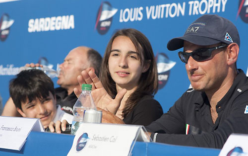 Louis Vuitton Trophy, La Maddalena, Sardegna. After day 2 of racing skippers were on hand at the press conference and the winner of the todays O'pen Bic class was Silvia Acheri, as Francesco Bruni helps her with the microphone and applauds the lst and 2nd place winners. Photo copyright Bob Grieser, Outsideimages NZ and Louis Vuitton Trophy.