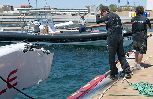 Louis Vuitton Trophy, WSTA La Maddalena, Sardinia, May-June 2010. Day 4. ALEPH's crew stares at the boat after their collision with Azurra. Photo copyright Paul Todd, Outsideimages NZ and Louis Vuitton Trophy.