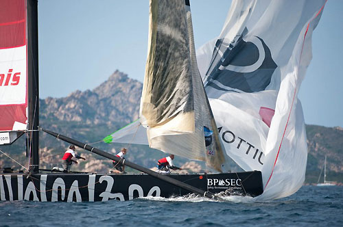 Louis Vuitton Trophy, La Maddalena, Italy. Race Day 8. Synergy (RUS) verses Artemis (SWE). The Artemis genaker pole goes overboard during the takedown, breaks and drags the genaker under the boat. Photo copyright Paul Todd, Outsideimages NZ and Louis Vuitton Trophy.