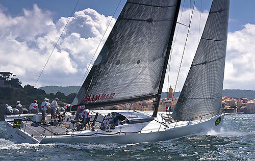 Neville Crichton's Mini Maxi Shockwave with St. Tropez at the background, during the Giraglia Rolex Cup 2010. Photo copyright Rolex and Kurt Arrigo.