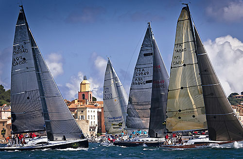 Fleet at the finish of the coastal race, Saint Tropez at the background, during the Giraglia Rolex Cup 2010. Photo copyright Rolex and Kurt Arrigo.