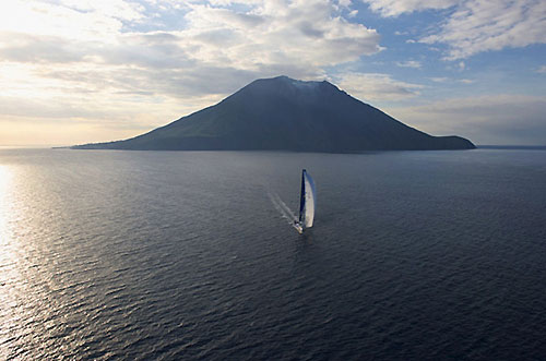 Igor Simcic's Esimit Europa 2 rounding Stromboli, during the 31st Rolex Middle Sea Race. Photo copyright Rolex and Kurt Arrigo.