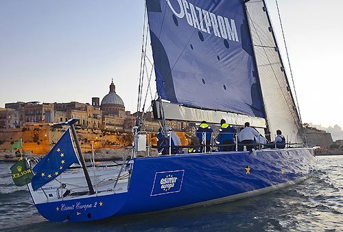 Igor Simcic's Esimit Europa 2, taking out Line Honours, crossing the finish line at 18:32:32 for the 31st Rolex Middle Sea Race. Photo copyright Rolex and Rene Rossignaud.