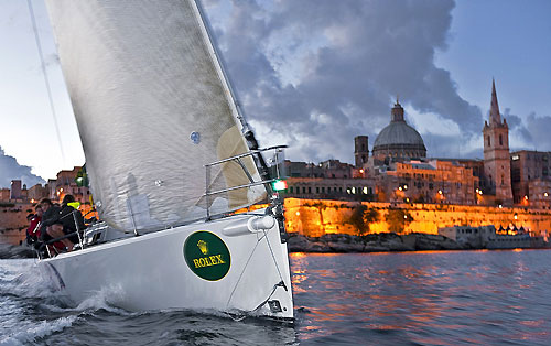 John Ripard and Andrew Calascione's J133 Jaru, arrives at the finish line of the 31st Rolex Middle Sea Race. Photo copyright Rolex and Kurt Arrigo.