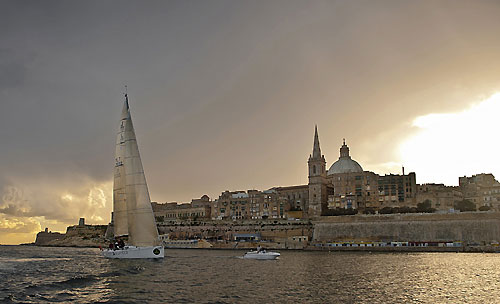 Lee Satariano and Christian Ripard's J122 Artie, arrives at the finish line of the 31st Rolex Middle Sea Race. Photo copyright Rolex and Kurt Arrigo.