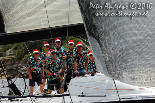 A boat-load of Santas' onboard Bob Steel's TP52 Quest, during the SOLAS Big Boat Challenge 2010 on Sydney Harbour. Photo copyright Peter Andrews, Outimage Australia.