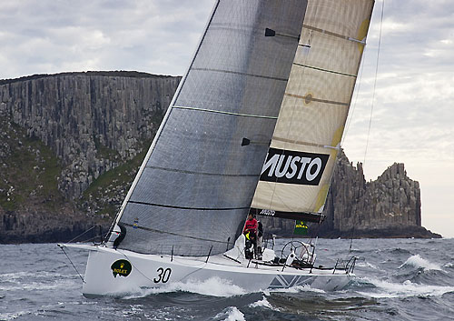 Geoff Boettcher’s South Australian yacht Secret Mens’ Business 3.5 crossing Storm Bay during the Rolex Sydney Hobart Yacht Race. Photo copyright Rolex and Daniel Forster.