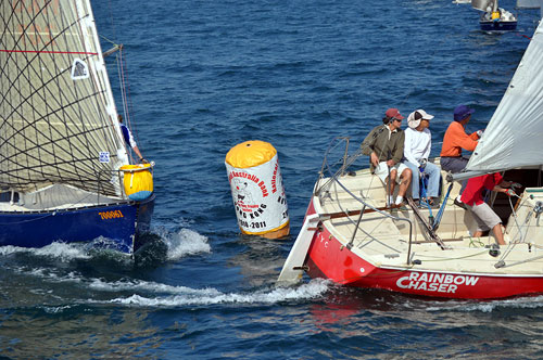 Rainbow Chaser rounds the top mark. Photo copyright RHKYC / Koko Mueller.