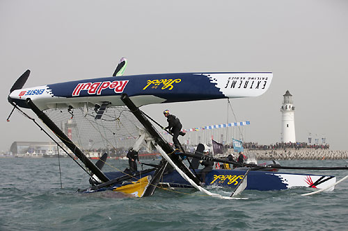 Team Red Bull Extreme Sailing capsizing on day 2 of racing, during the Extreme Sailing Series 2011, Qingdao, China. Photo copyright Lloyd Images.