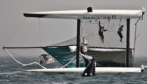 Team GAC Pindar, the 3rd capsize of day 3, during the Extreme Sailing Series 2011, Qingdao, China. Photo copyright Pipornetti for Niceforyou.