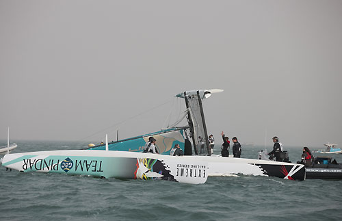 Team GAC Pindar and Oman Air after capsizing, during the Extreme Sailing Series 2011, Qingdao, China. Photo copyright Lloyd Images.
