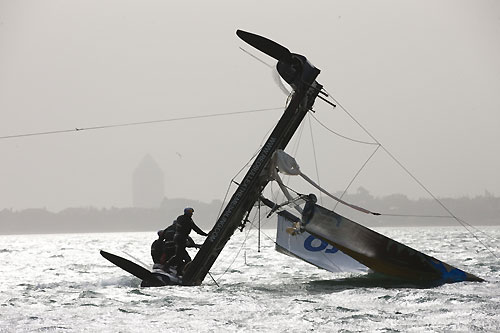 Red Bull Extreme Sailing capsize in race 4 on day 3, during the Extreme Sailing Series 2011, Qingdao, China. Photo copyright Lloyd Images.
