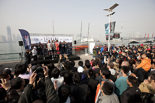 Crowds of fans and media watch the final prize giving, during the Extreme Sailing Series 2011, Qingdao, China. Photo copyright Lloyd Images.