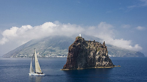 Wild Joe (HUN) sails pass Strombolicchio, during the Rolex Capri Sailing Week and Rolex Volcano Race, Capri, Italy. Photo copyright Rolex and Carlo Borlenghi.