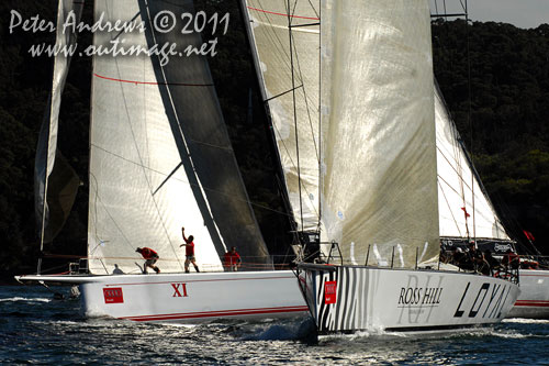 Anthony Bell's 100 ft maxi Investec Loyal and Bob Oatley's Reichel Pugh 100 Wild Oats XI tacking duel out of Sydney Harbour, after the start of the Audi Sydney Gold Coast 2011. Photo copyright Peter Andrews, Outimage Australia.