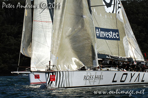 Anthony Bell's 100 ft maxi Investec Loyal and Bob Oatley's Reichel Pugh 100 Wild Oats XI tacking duel out of Sydney Harbour, after the start of the Audi Sydney Gold Coast 2011. Photo copyright Peter Andrews, Outimage Australia.