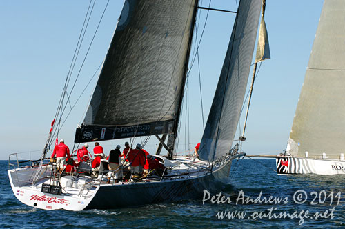 Anthony Bell's 100 ft maxi Investec Loyal and Bob Oatley's Reichel Pugh 100 Wild Oats XI tacking duel out of Sydney Harbour, after the start of the Audi Sydney Gold Coast 2011. Photo copyright Peter Andrews, Outimage Australia.