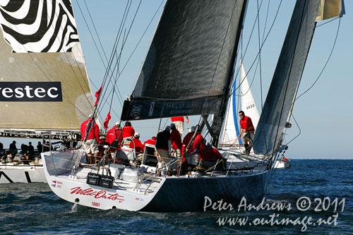 Anthony Bell's 100 ft maxi Investec Loyal and Bob Oatley's Reichel Pugh 100 Wild Oats XI tacking duel out of Sydney Harbour, after the start of the Audi Sydney Gold Coast 2011. Photo copyright Peter Andrews, Outimage Australia.