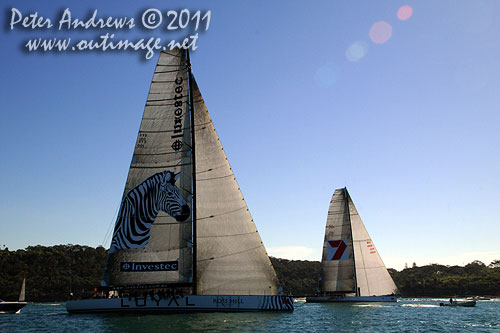 Anthony Bell's 100 ft maxi Investec Loyal and Bob Oatley's Reichel Pugh 100 Wild Oats XI tacking duel out of Sydney Harbour, after the start of the Audi Sydney Gold Coast 2011. Photo copyright Peter Andrews, Outimage Australia.